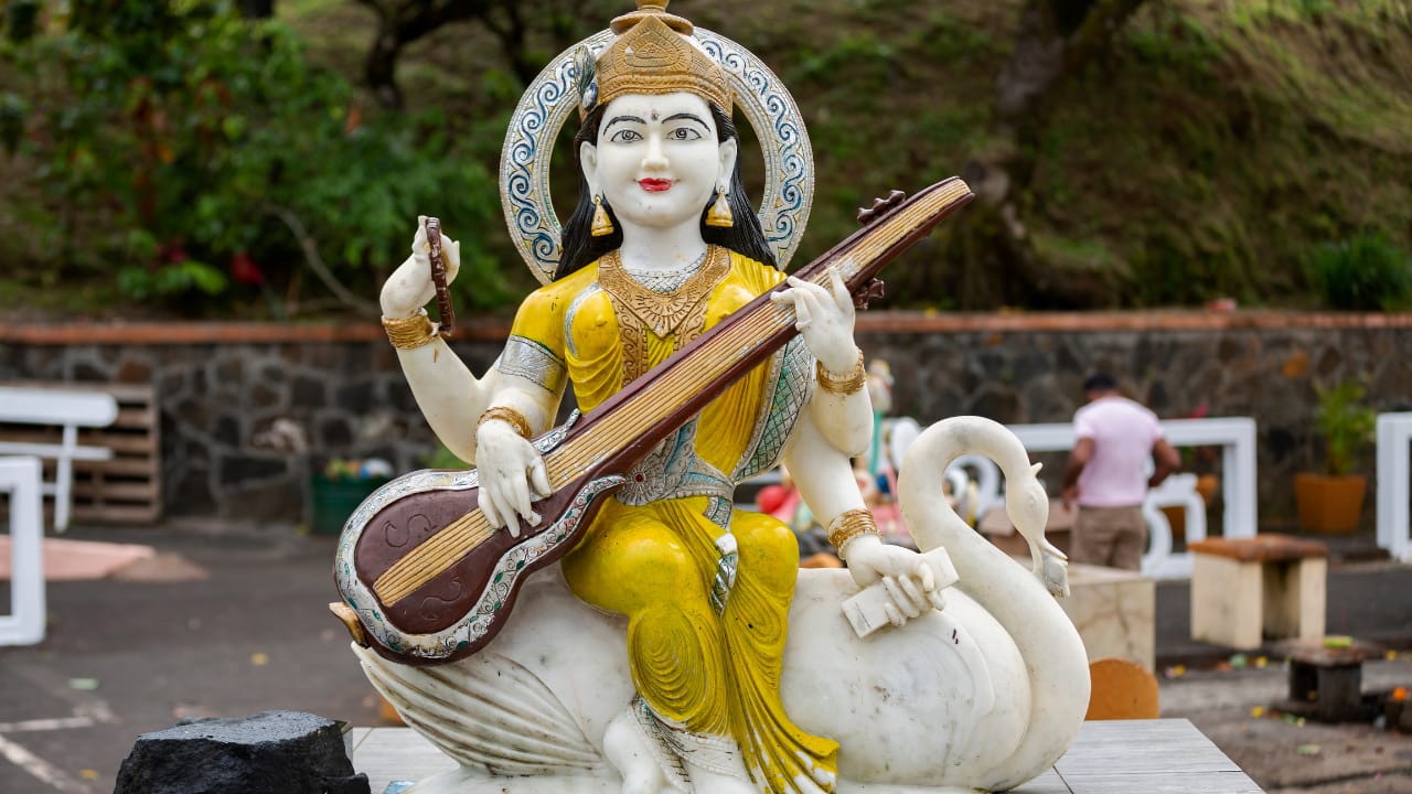 The Role of Yellow in Rituals: During Saraswati Puja, devotees wear yellow clothes and offer yellow sweets, fruits, and flowers to the goddess. This practice is believed to invite knowledge and creativity into their lives. (Image: Canva)