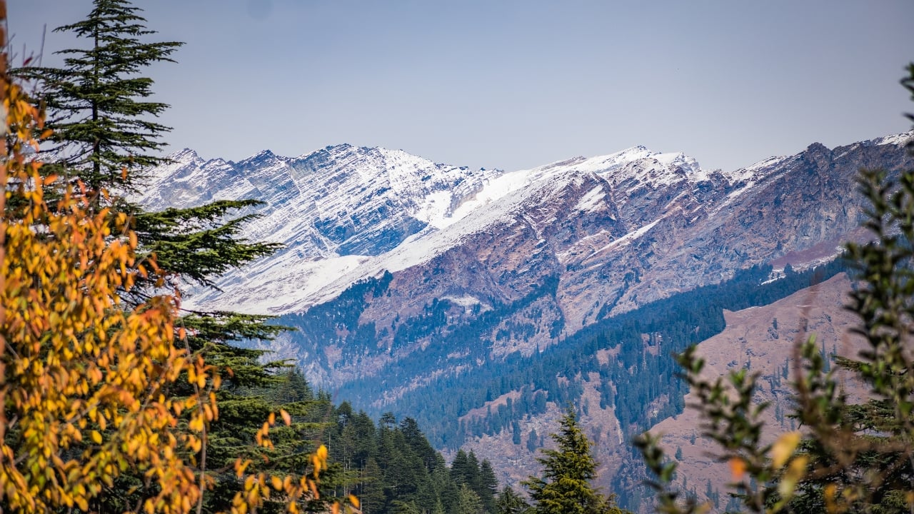 6. Nanda Devi, Uttarakhand Nanda Devi, one of the highest peaks in India, offers stunning views of the Himalayas. A trek to this sacred mountain is a spiritual and visual journey, with panoramic views of snow-covered peaks, deep valleys, and lush greenery. (Image: Canva)