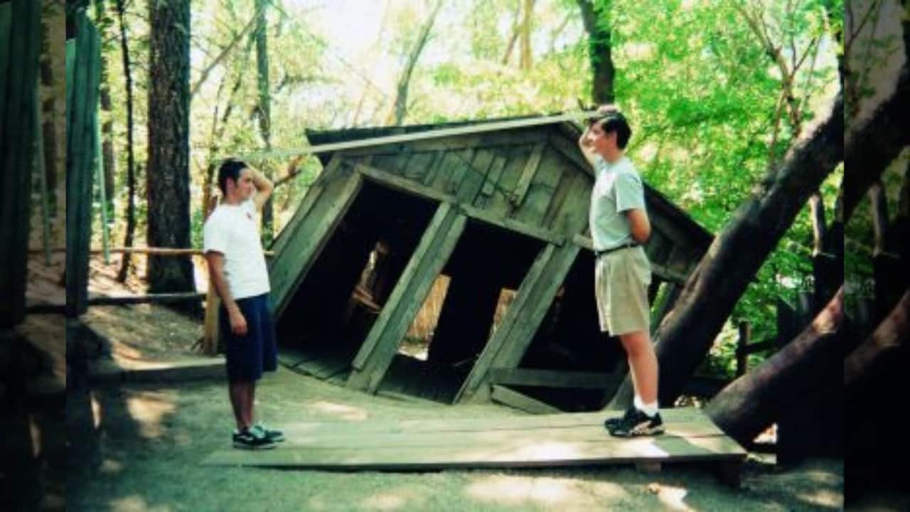 7. The Oregon Vortex Location: Gold Hill, Oregon, USA At the Oregon Vortex, people appear to change height and objects seem to roll uphill. Visitors often feel a strange force pulling them in different directions, making it a truly surreal experience. Whether it's an optical illusion or something more mysterious, this place will leave you wondering what’s real. (Image: Canva)