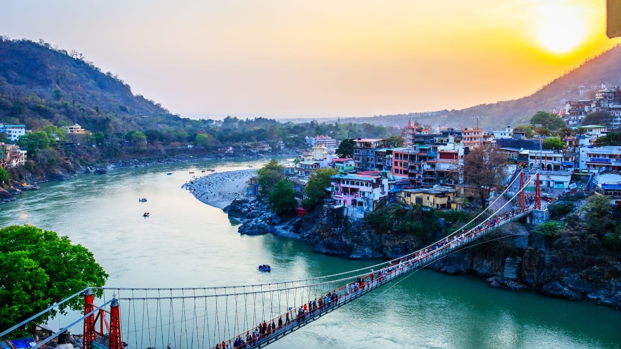 4. Rishikesh, Uttarakhand Rishikesh is an adventure lover's paradise and a peaceful retreat for those seeking spirituality. February offers cooler temperatures, making it ideal for rafting on the Ganges, hiking in the surrounding hills, or practicing yoga in serene ashrams. The quiet riverside walks and evening Ganga Aarti create a serene atmosphere you won’t forget. (Image: Canva)