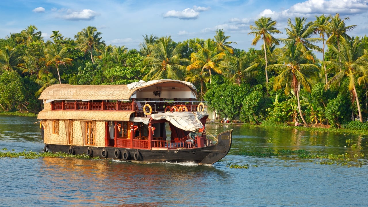 7. Kerala Backwaters Kerala's backwaters offer an unparalleled experience in February with the mild, pleasant weather. Set sail on a traditional houseboat and cruise through lush green landscapes, enjoying the peaceful waters, picturesque villages, and authentic Kerala cuisine. Whether you’re looking to relax or explore nature, Kerala in February promises pure bliss. (Image: Canva)