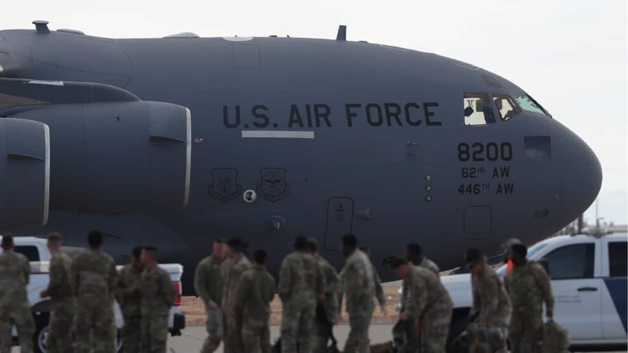 Expensive military planes, deportees in chains: Why Trump is crafting a powerful visual for the world