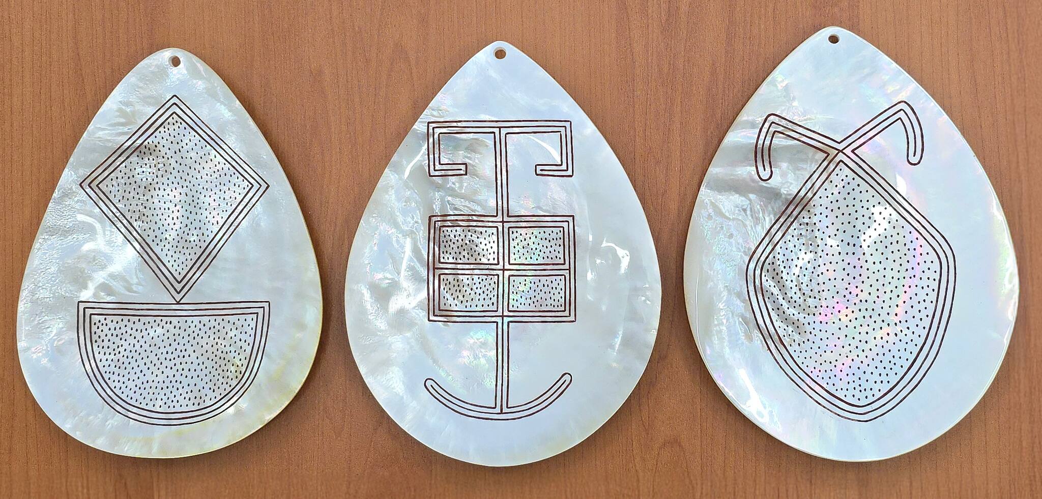 Carved pearl shell by Darrell and Garry