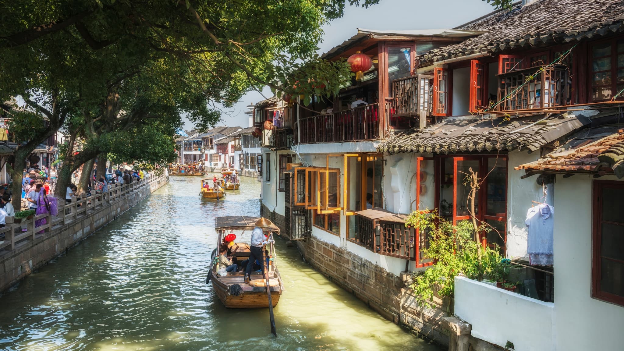 8. Zhujiajiao Floating Market, China Known as the “Venice of Shanghai,” Zhujiajiao is a stunning ancient town with picturesque canals and a charming floating market. Here, you can sample Chinese street food, browse beautiful pottery, and take in the tranquil vibes of this historical water town. Best Time to Visit: Early morning or late afternoon for peaceful exploration. (Image: Canva)