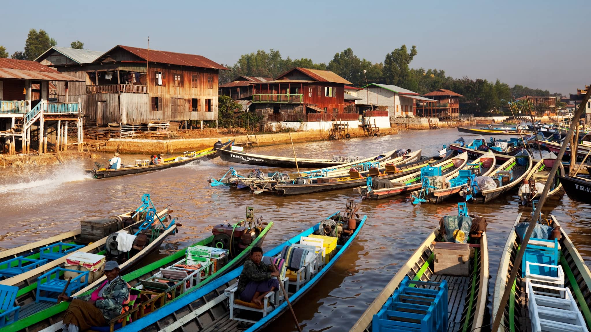 9. Inle Lake Floating Market, Myanmar In Myanmar’s Inle Lake, the floating markets aren’t just about shopping – they’re about culture. Boats filled with fresh produce, handmade textiles, and local crafts drift along the lake, surrounded by the stunning scenery of stilted houses and floating gardens. Best Time to Visit: Early mornings (especially during the dry season from November to February). (Image: Canva)