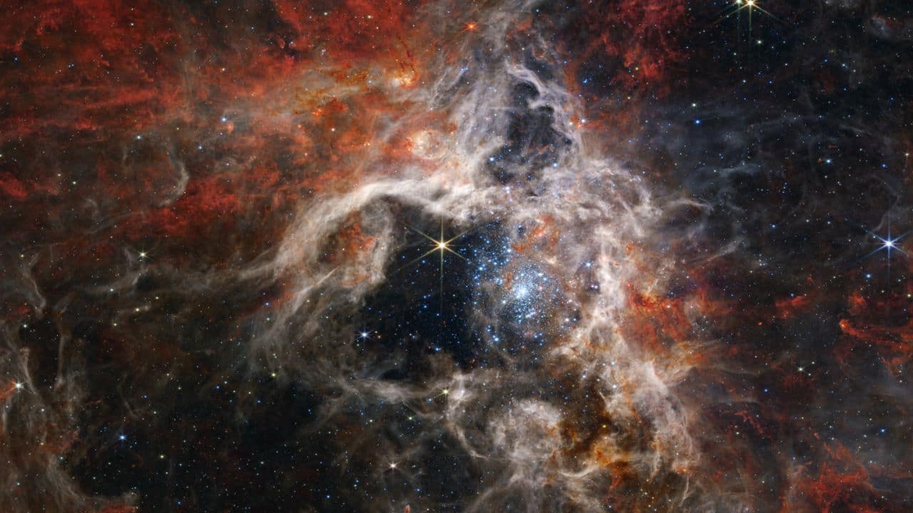 The Tarantula Nebula: Located in the Large Magellanic Cloud, the Tarantula Nebula's spider-like shape is home to a multitude of stars and star clusters. NASA's Hubble Space Telescope showcases its intricate details. (Image: NASA)