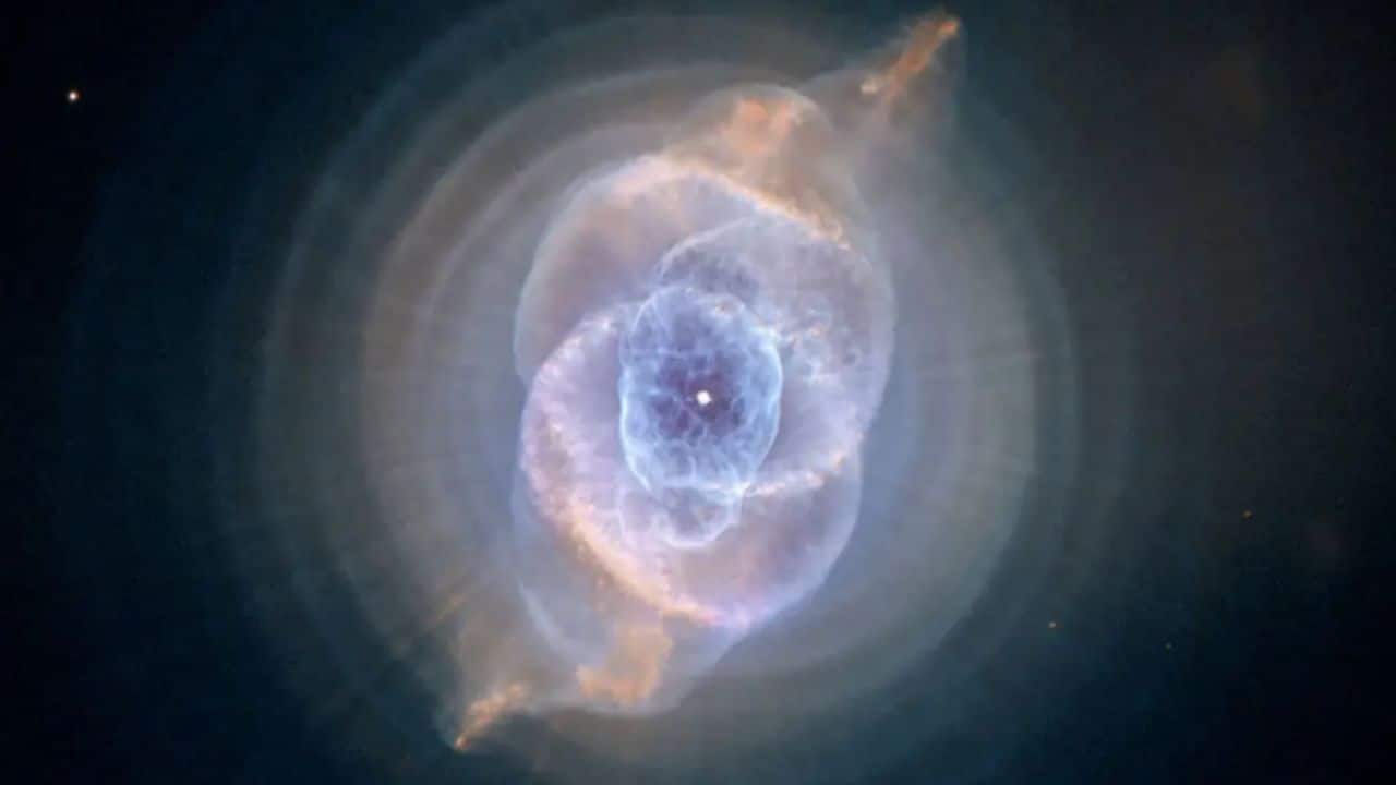 Cat’s Eye Nebula: The Cat’s Eye Nebula, or NGC 6543, is a mesmerising planetary nebula with intricate, layered shells of gas. Located 3,000 light-years away, its eerie, glowing structure results from a dying star’s violent outbursts. (Image: NASA)