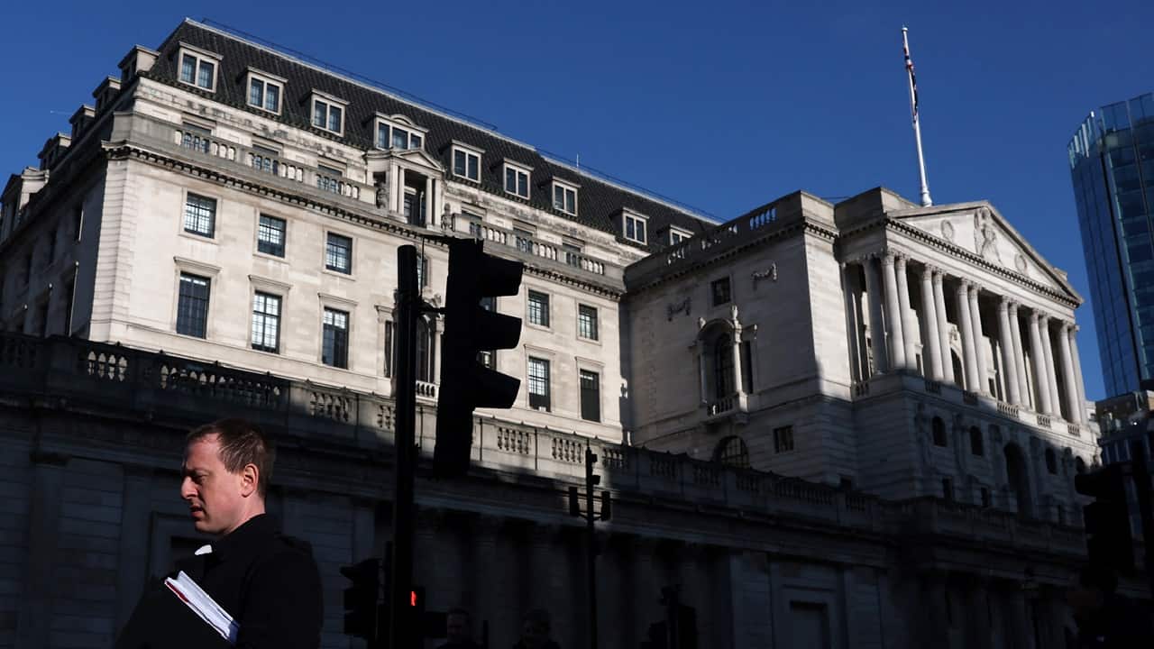 Bank of England cuts rates, sees higher inflation and weaker growth