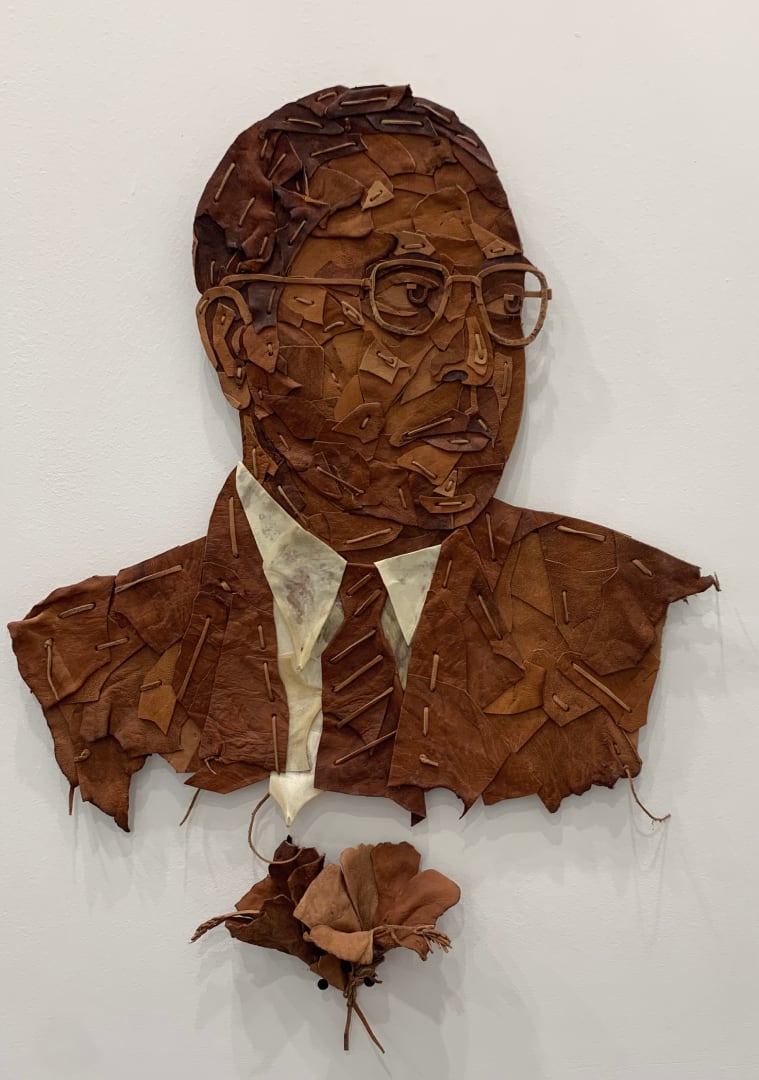 Metalworks, leather, lace, embroidery, paper, glass, brass... the materiality of the medium speaks volumes in some of the better works of art. Consider this wall-mounted piece by Madhukar Mucharla: Titled Baba Saheb, it is made with stitched leather and evokes so much history - of trade, of caste, of brutality and of the things BR Ambedkar fought for. Though Ambedkar has never been out of the news for any prolonged period in India, conversations around the Indian Constitution which completed 75 years this year have sparked even greater interest in his ideas and ideals lately. Here's what the young artist wrote on his Instagram alongside a photo of this work: &quot;#babasaheb vision transcended mere legislation, he pioneered a movement that emphasized education, equality, and dignity for all.&quot; Don't miss the flower shradhanjali to the bottom left.