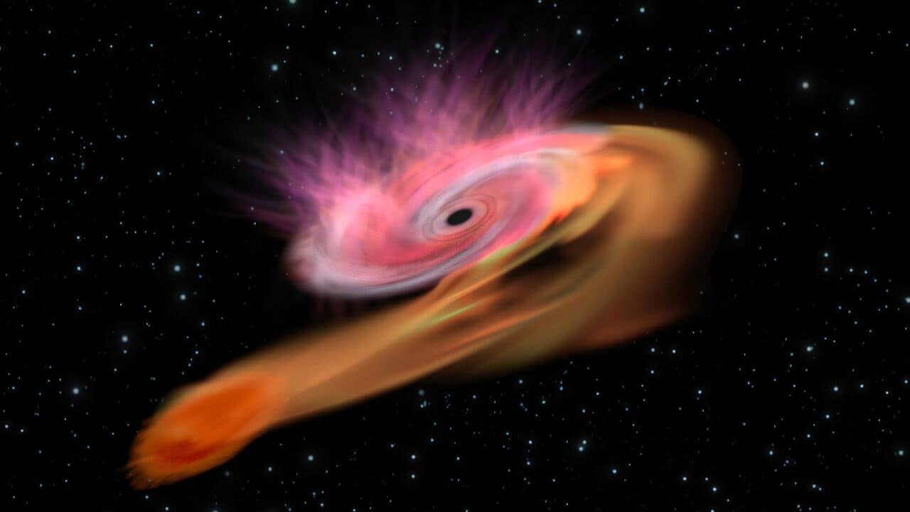 An artist's illustration of a tidal disruption event, where a black hole consumes a star. (Image: NASA)