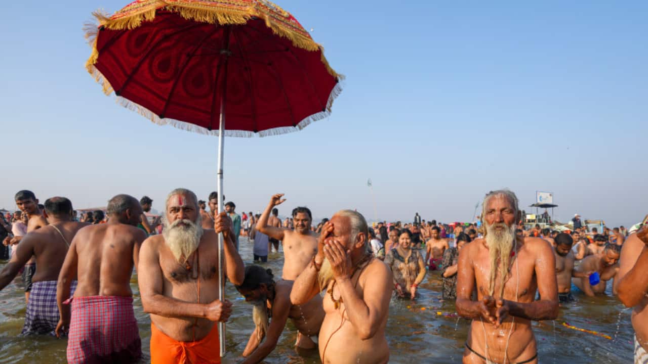Sadhus, draped in saffron, perform Vedic rituals on the banks of the Sangam before taking a dip on Maghi Purnima. The scene is a blend of ancient traditions and deep spirituality. (Image: PTI)