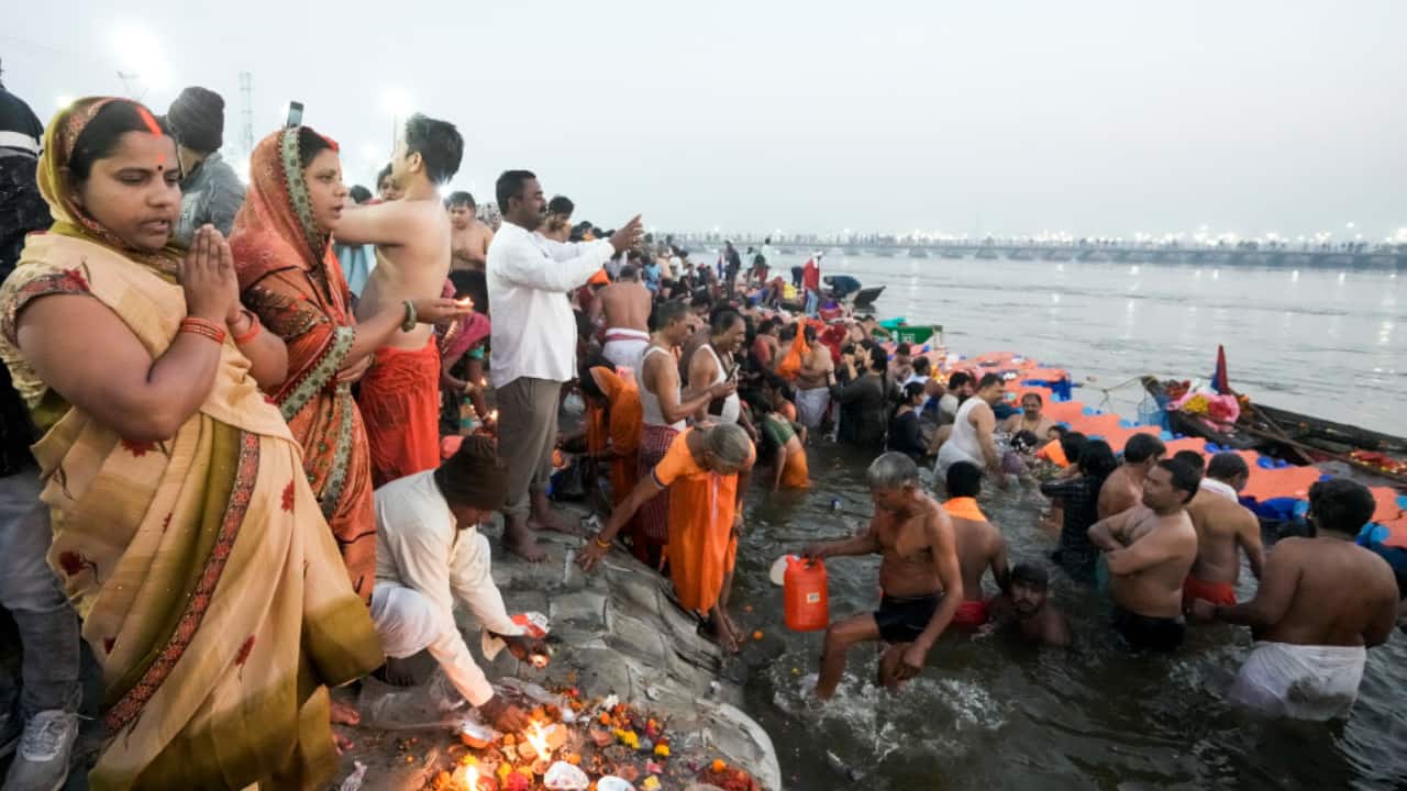 A devotee, with folded hands and eyes closed, prays after emerging from the holy waters of the Sangam, seeking divine blessings on the auspicious occasion of Maghi Purnima. (Image: PTI)