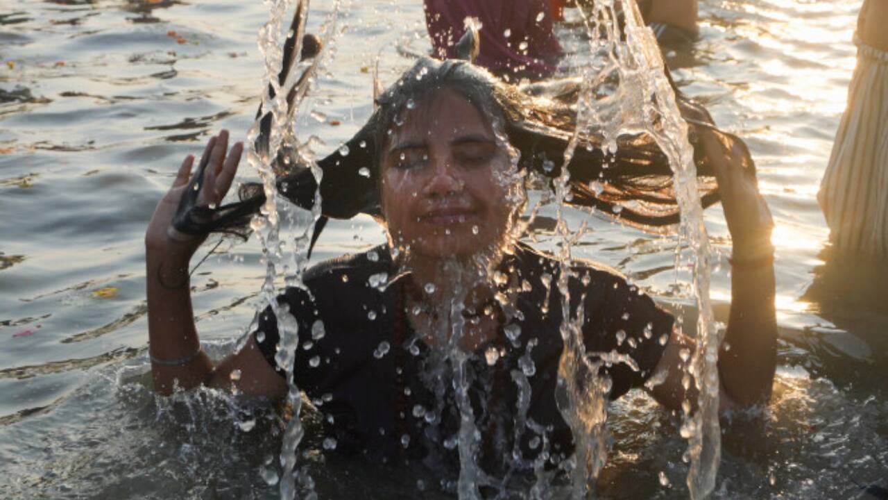 Foreign devotees, drawn to the spiritual aura of Maha Kumbh, participate in the Maghi Purnima Snan, experiencing the deep-rooted traditions and culture of Sanatan Dharma. (Image: PTI)