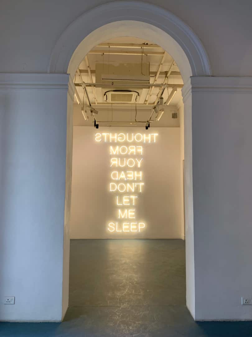 Shilpa Gupta's 'Thoughts from your head don't let me sleep' began as a drawing, and then became a neon installation and printed T-shirt, too.