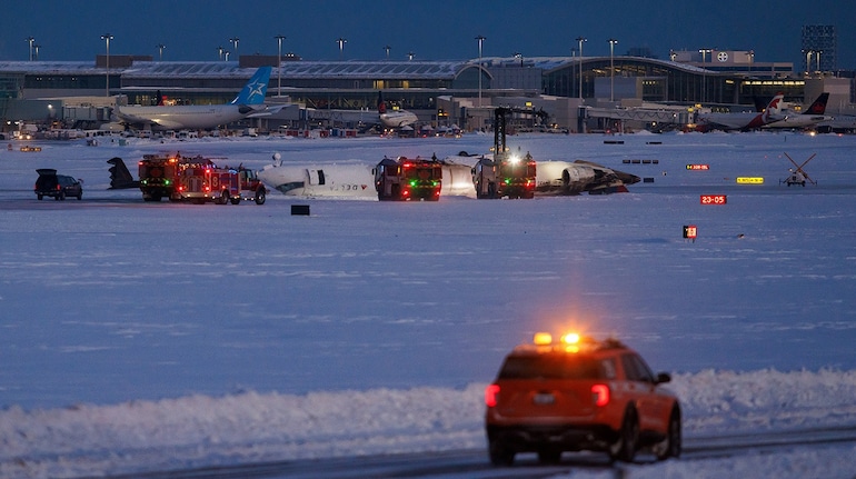 Delta plane flips upside down on landing at Toronto airport, injuring 18