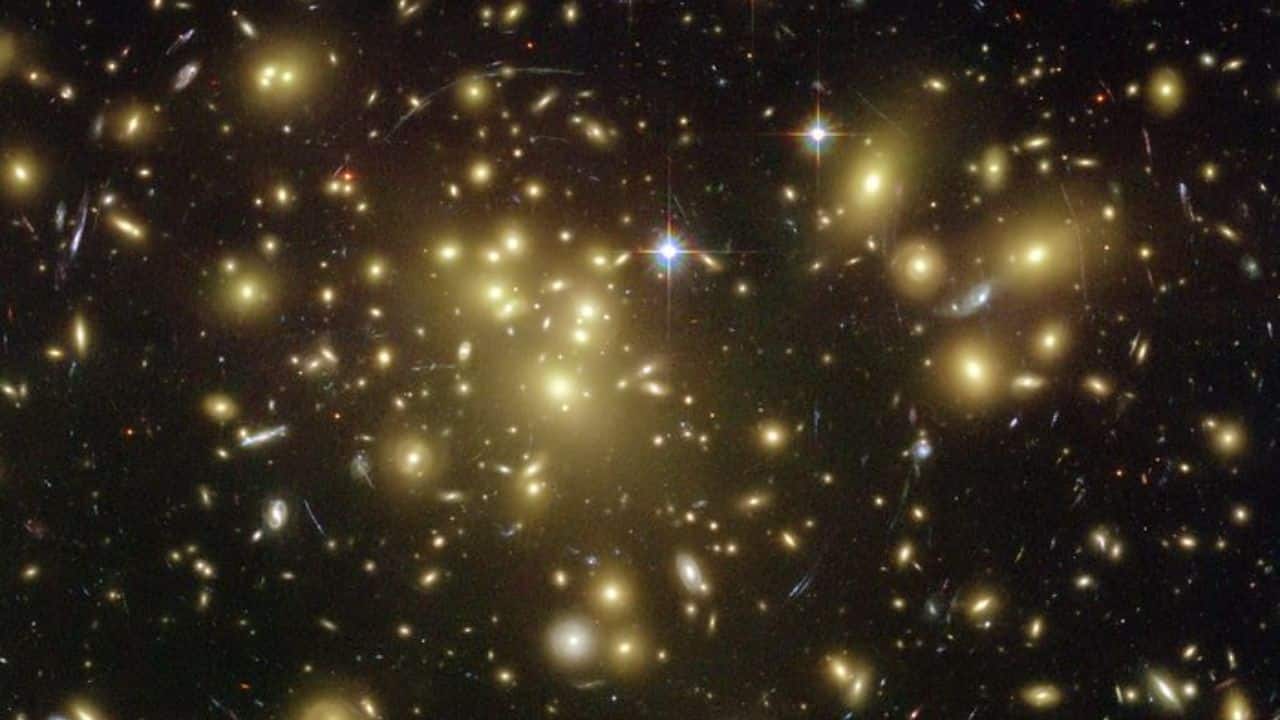 A1689-zD1 (12.5 Billion Years Old): This distant galaxy has a high redshift, indicating its immense distance from us and offering a glimpse into the early universe. (Image: NASA/ESO)