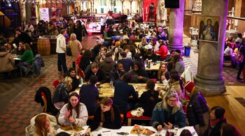People socialise while attending an event run by The Offline Club, at the Sherriff Centre in London. (Image credit: AFP)