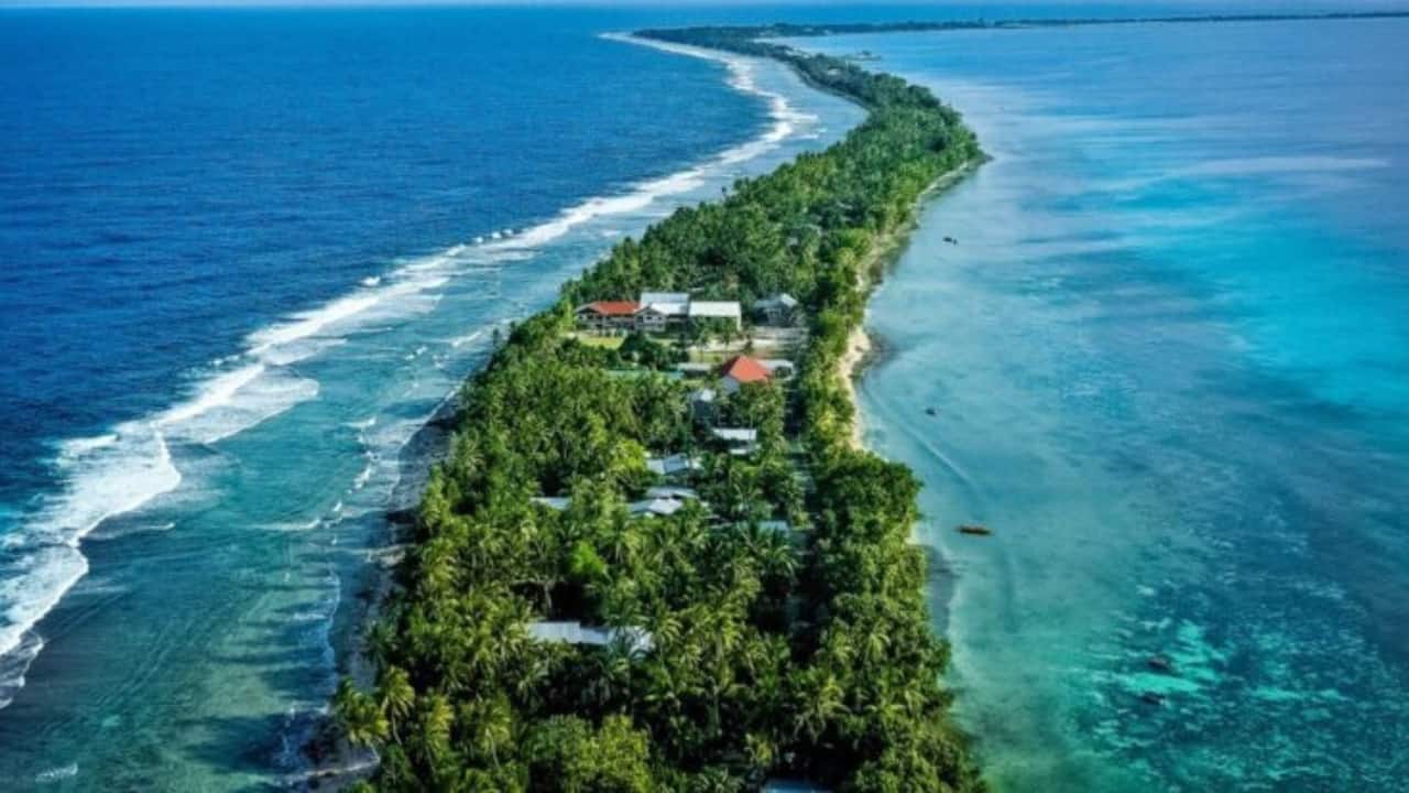 4. Tuvalu – A Coral Atoll Adventure (26 sq km / 10 sq mi) This remote Pacific paradise is made up of tiny atolls, with its capital, Funafuti, being just 10 km long. Walk along white-sand beaches, meet friendly locals, and soak in the island’s relaxed Polynesian vibe—all within a day. (Image: Canva)
