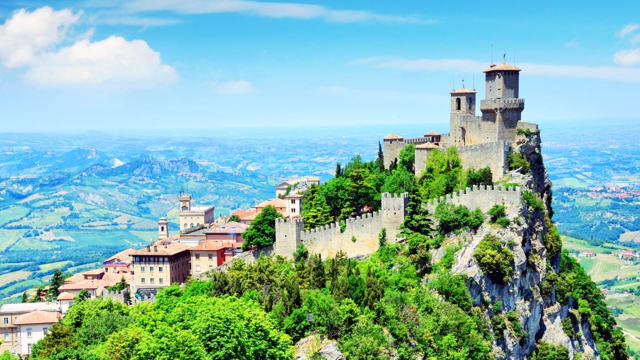 5. San Marino – A Medieval Dream (61 sq km / 23 sq mi) Perched on Monte Titano and surrounded by Italy, San Marino is a fairytale-like country best explored on foot. Wander through its cobbled streets, visit its medieval fortresses, and take in breathtaking views of the Italian countryside. (Image: Canva)