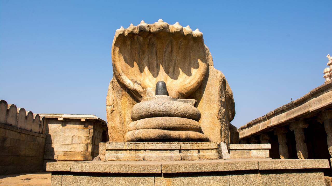 9. Lepakshi, Andhra Pradesh – Legendary Town Lepakshi is a storyteller, not only a historic town. Every pillar of the Veerabhadra Temple and every mural there whispers historical stories. The temple is well known for its hanging pillar that hardly makes sense given gravity and logic. Then there is the enormous Nandi sculpture, among India's largest monolithic bull statues. Wander among the ancient ruins, pay attention to the local folklore, and step back into a time of monarchs and stories. (Image: Canva) 9. Lepakshi, Andhra Pradesh – Legendary Town Lepakshi is a storyteller, not only a historic town. Every pillar of the Veerabhadra Temple and every mural there whispers historical stories. The temple is well known for its hanging pillar that hardly makes sense given gravity and logic. Then there is the enormous Nandi sculpture, among India's largest monolithic bull statues. Wander among the ancient ruins, pay attention to the local folklore, and step back into a time of monarchs and stories. (Image: Canva)
