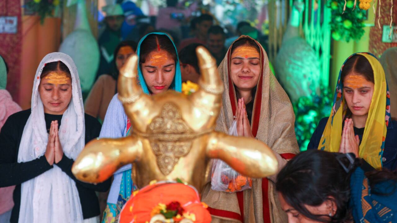 2. Jammu | At the historic Ranbireshwar temple, devotees bow in reverence, offering prayers and performing rituals in honour of Lord Shiva on Maha Shivratri in Jammu. (Image: PTI)