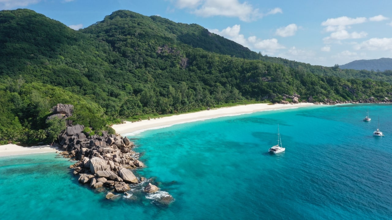 1. Forget the Maldives; Embrace Seychelles instead. Though Seychelles presents a calmer, tropical paradise, the private overwater bungalows of the Maldives are legendary. Unspoiled beaches, great biodiversity, and luxury resorts abound on this collection of Indian Ocean islands. Imagine romantic walks along immaculate beaches, glistening clear waters, and rich woods devoid of the crowded beaches. La Digue and other islands provide privacy; the natural beauty will astound you. (Image: Canva)