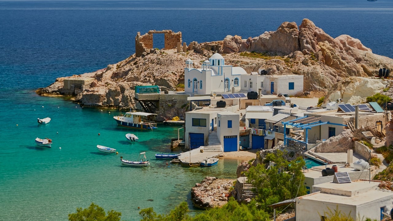 3. Give up Santorini for Milos. Though Milos, a lesser-known Greek island, presents comparably breathtaking scenery free from the crowds, Santorini is well-known for its postcard-perfect sunsets. Milos is all about relaxed luxury with its unusual volcanic terrain, secret beaches, and glistening clear seas. Discover the dream beaches of Sarakiniko, unwind in a beachside bar, and let the soft waves create the ambiance for your romantic getaway. (Image: Canva)