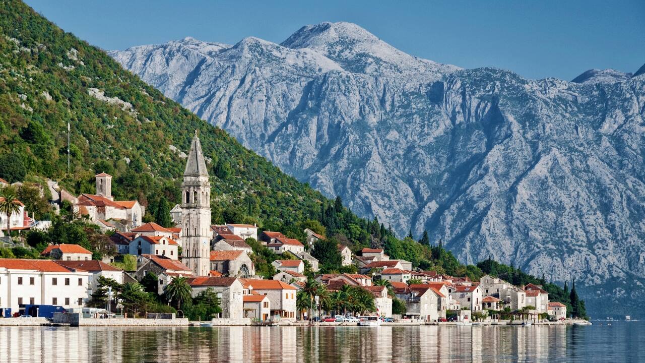 3. Kotor, Montenegro – Where the Mountains Meet the Sea Tucked away in a fjord-like bay, Kotor is an Instagrammer’s dream. Vlog your climb to San Giovanni Fortress for a breathtaking panoramic view and explore its medieval alleys filled with street cats and lively cafés. (Image: Canva)