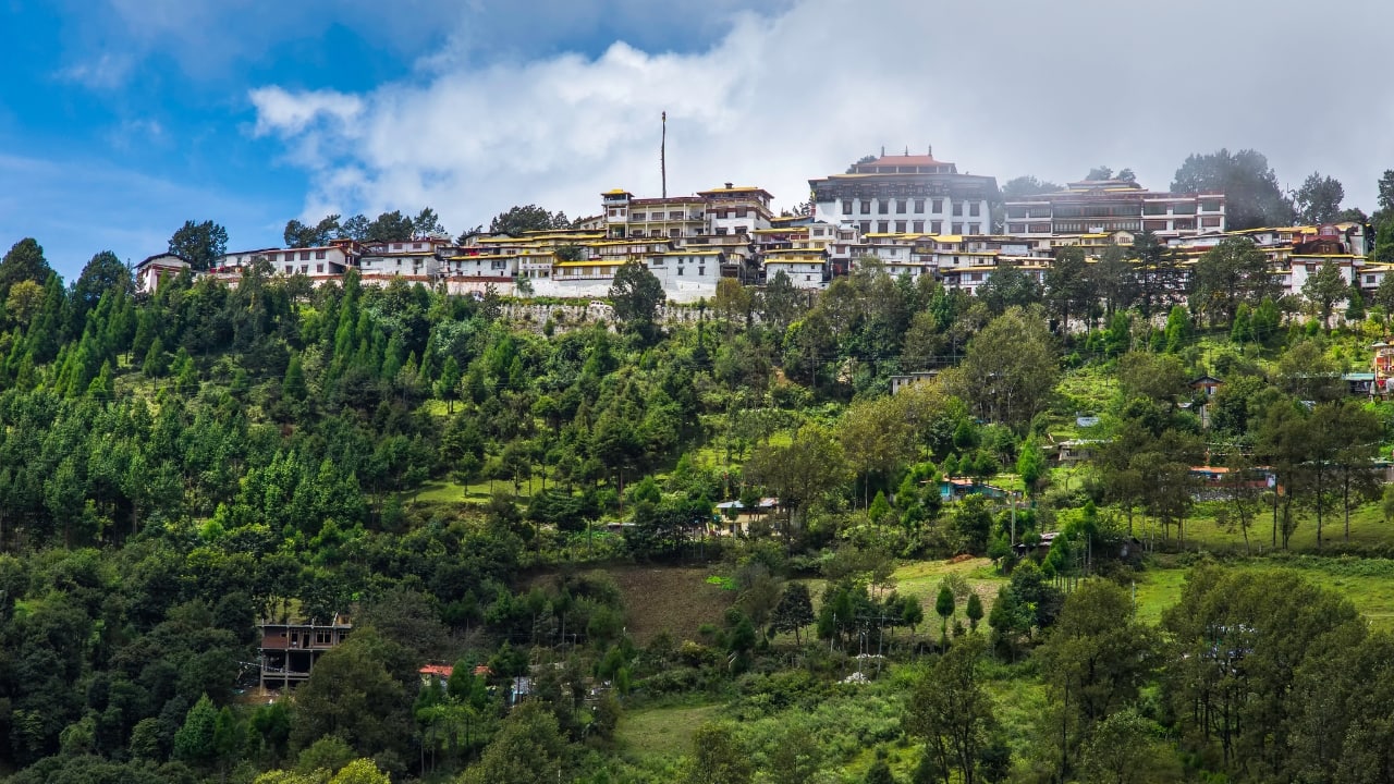 5. Tawang, Arunachal Pradesh – A Monastery Wedding Escape For a truly unique wedding, Tawang offers stunning Buddhist monasteries, serene lakes, and breathtaking mountain landscapes. A spiritual, intimate, and unforgettable wedding experience awaits here. (Image: Canva)