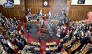 Smoke grenades tossed in Serbian parliament, lawmaker suffers stroke