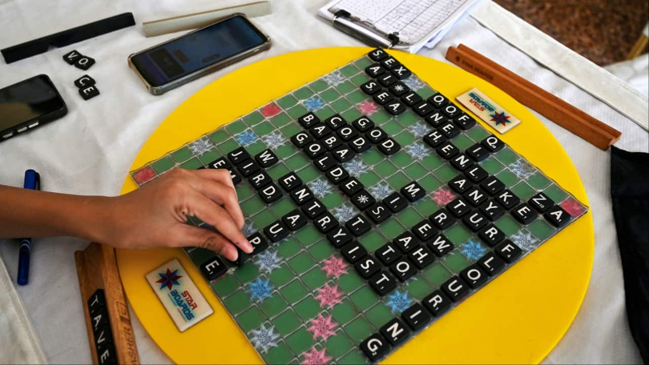 Pakistani prodigy Bilal Asher, world under-14 Scrabble champion, competes against professional Scrabble coach Waseem Khatri during an event organised by the Pakistan Scrabble Association (PSA) at the Beach Luxury hotel in Karachi. (Image credit: AFP)