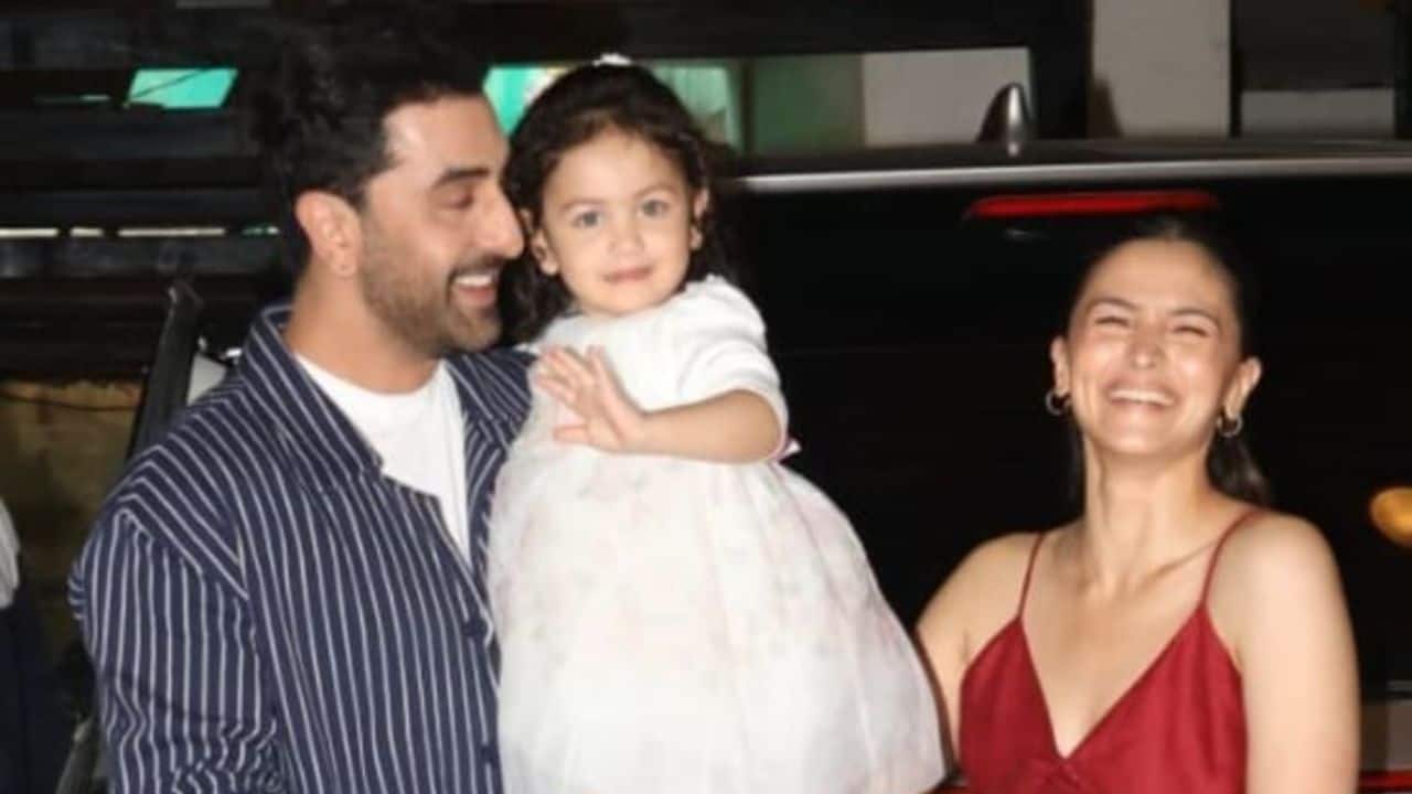 Ranbir Kapoor holds daughter Raha in his arms, as he and Alia Bhatt return from their London trip
