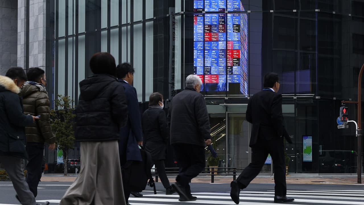 Asian markets make tepid gains as US shutdown set to end