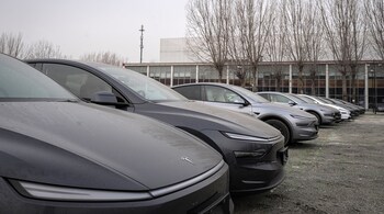 Dust-covered Tesla electric vehicles outside one of the company’s dealerships in Beijing on March 7.Photographer: Na Bian/Bloomberg