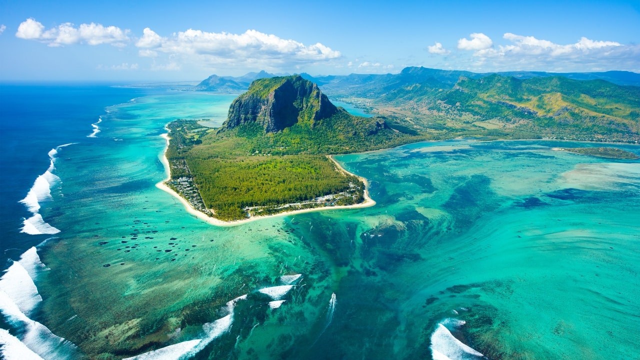 6. Mauritius – A Tropical Haven Visa Policy: Visa-free for up to 90 days Mauritius is a postcard-perfect island getaway with powdery beaches, lush forests, and stunning waterfalls. Explore the Black River Gorges National Park, visit Port Louis for its colonial charm, or dive into the Blue Bay Marine Park for snorkeling. Budget Breakdown: Flights: Rs 35,000 Stay: Airbnb Rs 1,500 per night Daily expenses: Rs 2,500–Rs 3,500 Travel Tip: Use local buses and eat at small family-run eateries to cut costs. (Image: Canva)