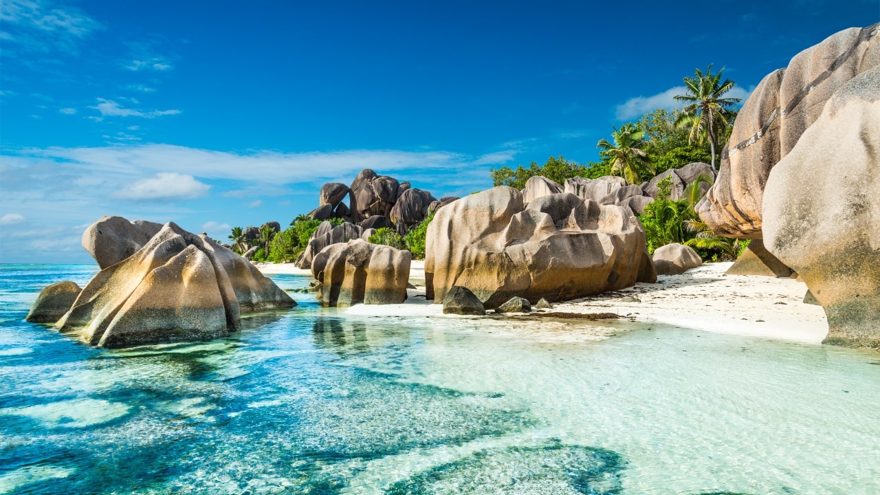 7. Seychelles – An Exotic Getaway Visa Policy: Visa-free for up to 90 days Seychelles is a dream destination with pristine beaches, crystal-clear waters, and lush greenery. Visit Morne Seychellois National Park, explore Victoria (one of the world’s smallest capitals), or relax at Anse Lazio Beach. Budget Breakdown: Flights: Rs 30,000 Stay: Guesthouses Rs 2,000 per night Daily expenses: Rs 3,000 Travel Tip: Shop for fresh fruits and local snacks at markets instead of dining in expensive beachside restaurants. (Image: Canva)
