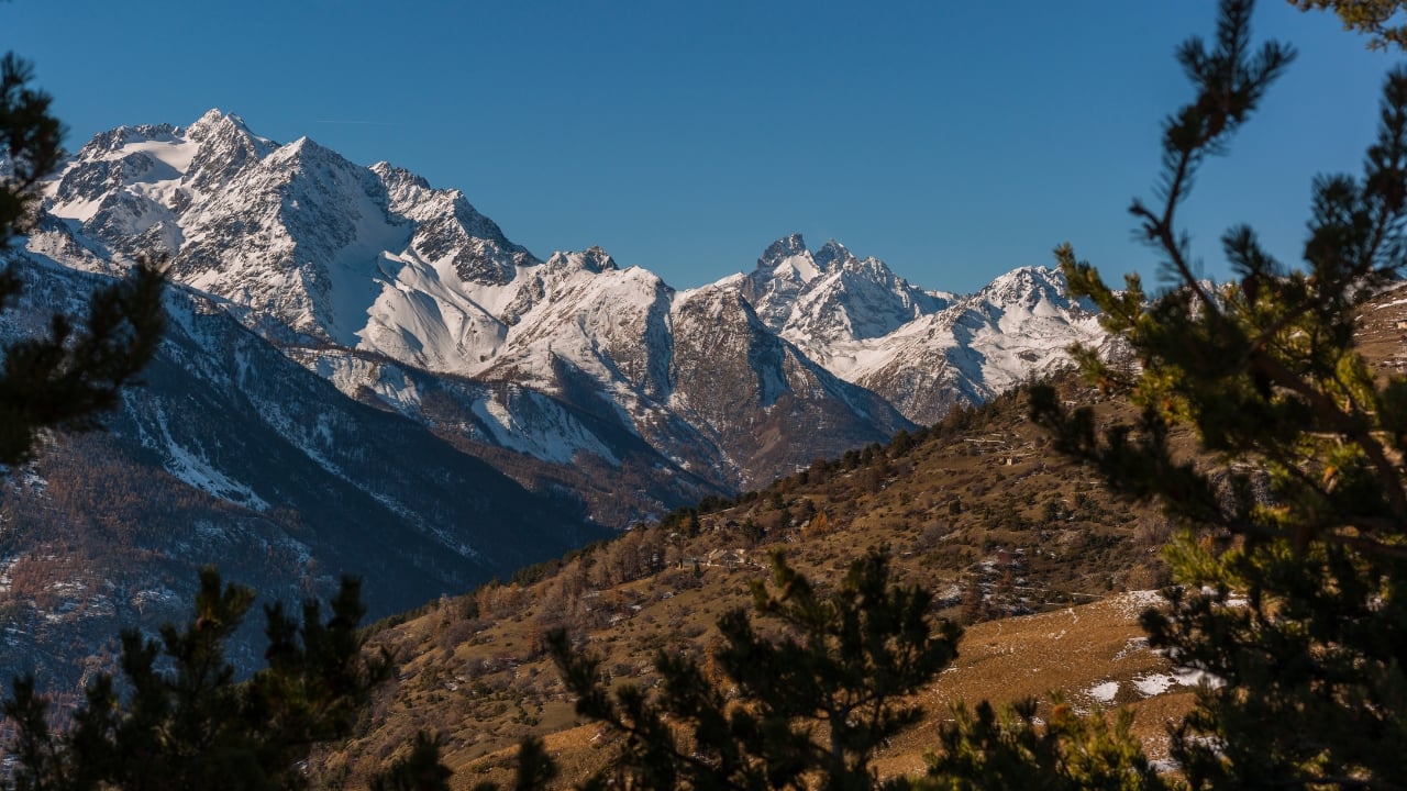 5. Écrins National Park, France – A Hiker’s Paradise If the idea of hiking through alpine meadows filled with wildflowers sounds like heaven, Écrins National Park is for you. Nestled in the French Alps, it’s the kind of place where you can breathe in crisp mountain air, dip your feet in glacial streams, and maybe even spot an ibex or two climbing the rocky cliffs. Summer here is simply spectacular. (Image: Canva)