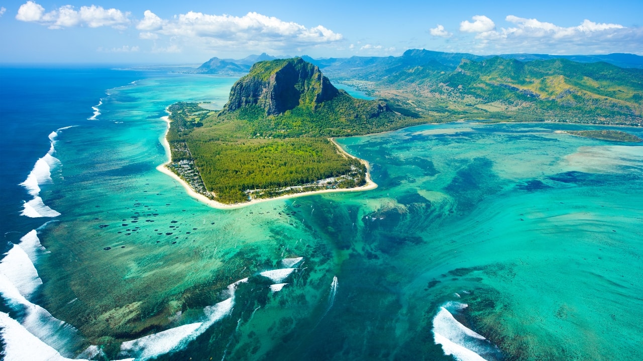 11. Mauritius – Tropical Bliss Without the Big Bill Mauritius isn’t just for luxury seekers. Hike lush trails, stroll through colorful markets, and bask on white-sand beaches with your loved ones. Visa: No visa required for Indian citizens (stay up to 90 days). Budget Tip: Look for package deals that bundle accommodation and activities to save more. (Image: Canva)