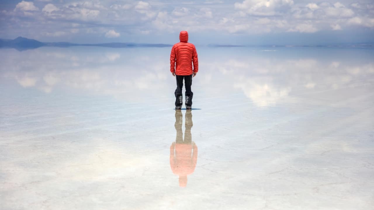 3. Salar de Uyuni – Bolivia’s Giant Mirror Picture this: you’re walking across a landscape so reflective, it’s impossible to tell where the sky ends and the earth begins. Welcome to Bolivia’s Salar de Uyuni, the world’s largest salt flat. After a rain, the thin layer of water covering the salt crust turns the ground into a giant mirror, blurring the line between reality and illusion. It’s like stepping into a dream where the world is flipped upside down. (Image: Canva)