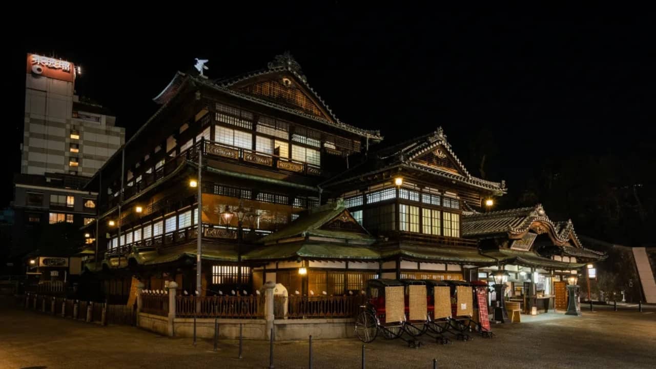 1. Dōgo Onsen, Japan – The Real Spirited Away Bathhouse Tucked away in Matsuyama, Dōgo Onsen is Japan’s oldest hot spring, and it’s easy to see why it’s often compared to Spirited Away’s bathhouse. With its elegant wooden architecture, glowing lanterns, and steaming waters, you half expect Chihiro to be running past at any moment. Step inside, soak in the legendary waters, and let yourself be transported to a different time. (Image: Japan Travel)