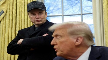 Elon Musk listens to U.S. President Donald Trump speak in the Oval Office of the White House in Washington, D.C. (File Photo)