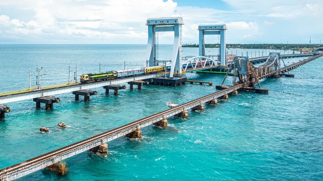 Revolutionary Vertical Lift Technology With its cutting-edge vertical lift mechanism, the new Pamban Bridge stands 22 meters above sea level, allowing ships to pass seamlessly without disrupting train movement. It features an electro-mechanical interlocking system, ensuring that the lift operation is synchronized with railway traffic for maximum safety. Designed to withstand seismic activity and cyclonic storms, the bridge is an engineering marvel, making it a crucial link for travel and trade. (Image: PTI)