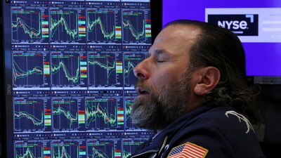 Dow falls more than 600 points as crude prices jump after tanker strike, while Berkshire Hathaway shares rise following buyback disclosure.