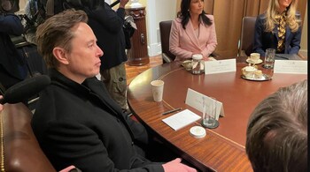 A picture on the X showed Musk looking ahead with a name card, a notepad, a pen, and an empty glass in front of him.