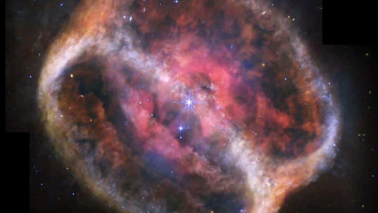 NASA Webb captures glowing hourglass nebula shaped by dying twin stars