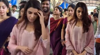 She is seen wearing a simple pink salwar suit and walking gracefully into the temple. She even paused for a moment to click a photo with a fan before going in for the darshan.