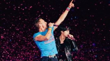 Jin performs with Coldplay after military service