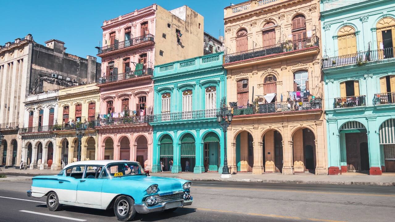 4. Old Havana, Cuba Old Havana is like walking through a vintage postcard, with its stunning pastel buildings and cobbled streets. This UNESCO World Heritage site is a blend of colonial charm and vibrant colors, where every building tells a story. Whether you're sipping a mojito on a sun-drenched terrace or wandering down a colorful alley, Havana offers a timeless, colorful escape. (Image: Canva)