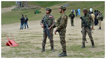 Security force personnel stand guard at the site of Pahalgam attack (Reuters)