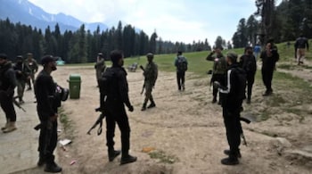 Security personnel inspect the site in the aftermath of an attack in Pahalgam on April 23. (Image: TAUSEEF MUSTAFA/AFP)